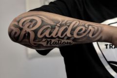 Smoky-Raider-Nation-Forearm-Tattoo